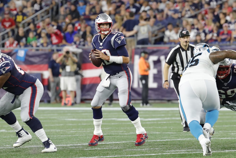 AUGUST 22: New England Patriots quarterback Tom Brady (12) stands in the pocket during a preseason game between the New England Patriots and the Carolina Panthers on August 22, 2019, at Gillette Stadium in Foxborough, Massachusetts.