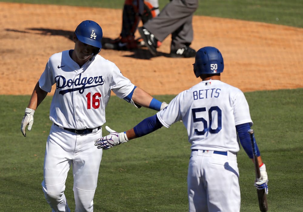 Los Angeles Dodgers catcher Will Smith (16) gets congratulated by Los Angeles Dodgers outfielder Mookie Betts after hitting a home run